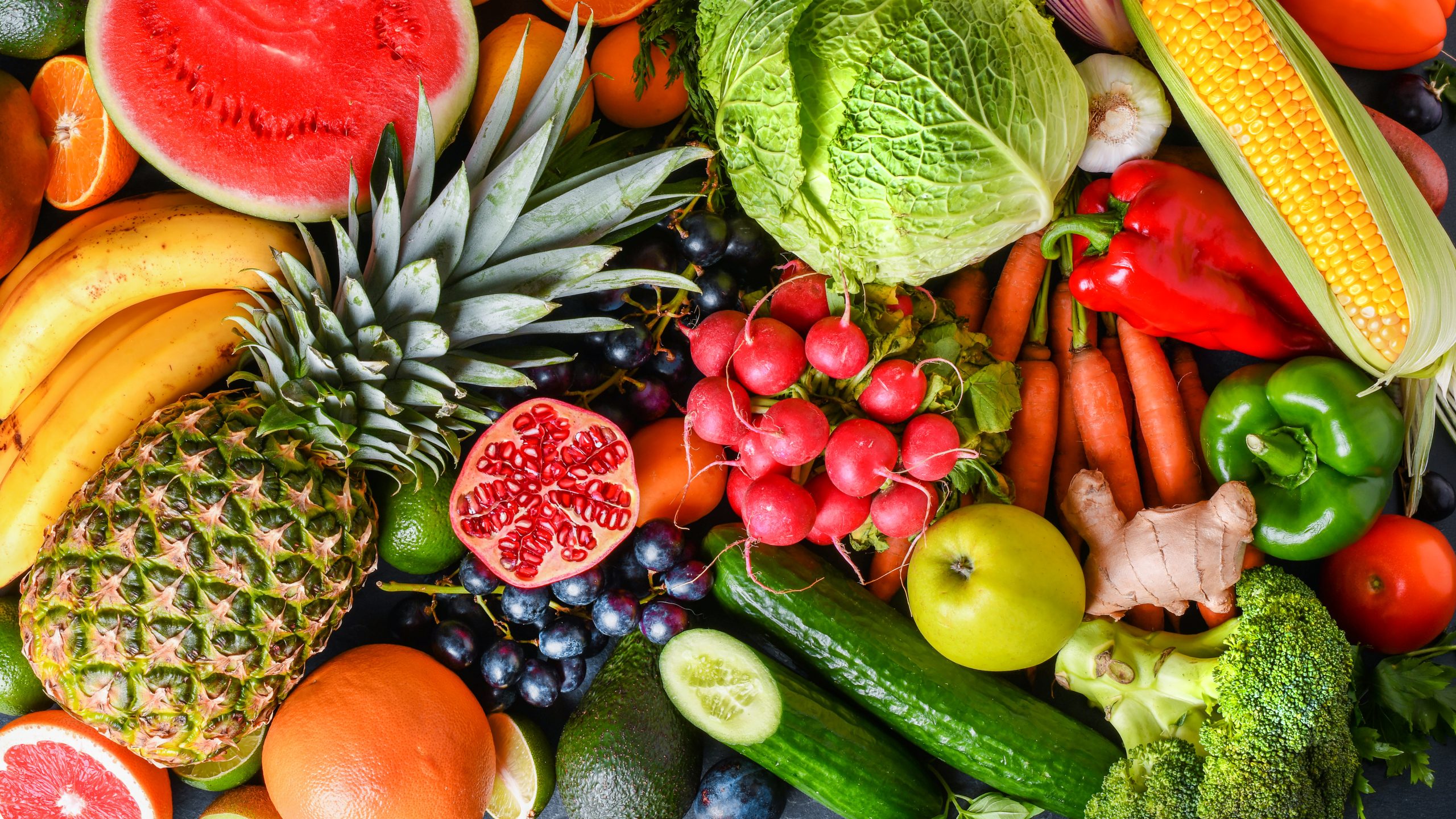A variety of fresh fruits, healthy vegetables top view. Large ve